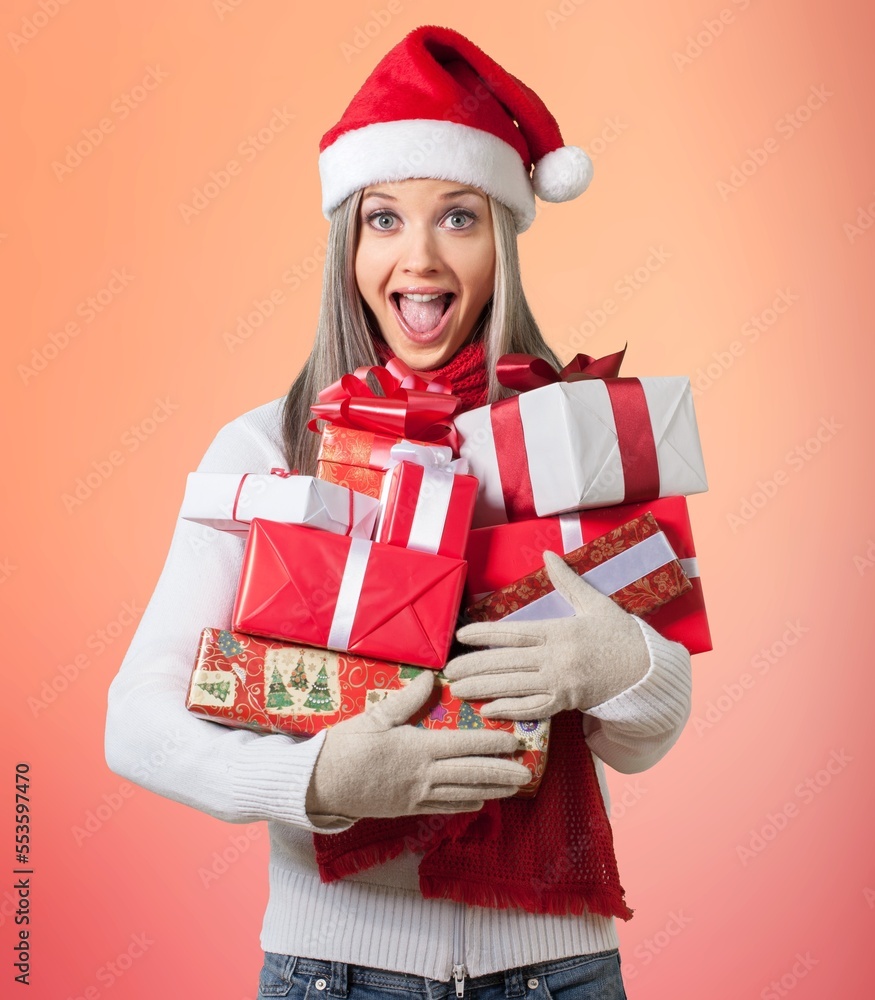 Young woman holds Christmas gift boxes Young woman holds Christmas gift boxes