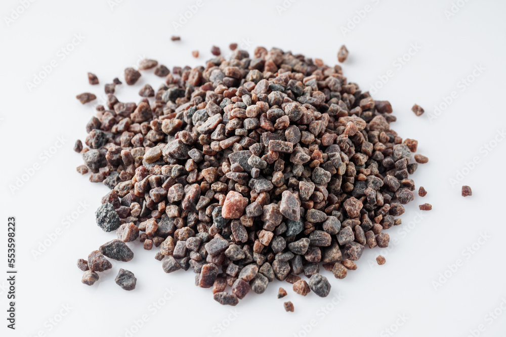 crystalline black Himalayan salt on a white background crystalline black Himalayan salt on a white background