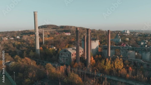 Abandoned old production plant, cement plant in Bedzin, Grodzisk, Poland. Concept of abandoned places, industrial ruins, urbex. View from the drone, air. photo