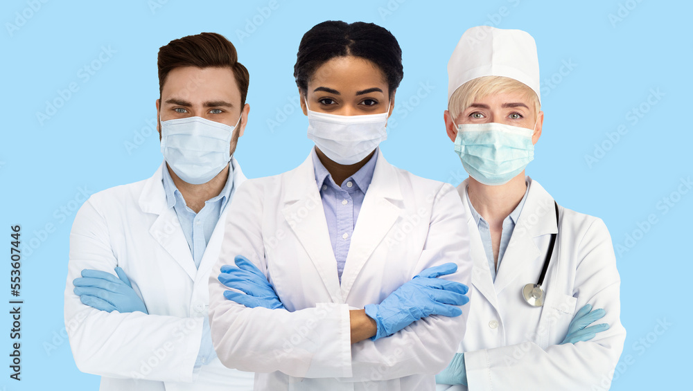 Medical Team. Group Of Multiethnic Doctors In Uniform And Protective Masks Medical Team. Group Of Multiethnic Doctors In Uniform And Protective Masks
