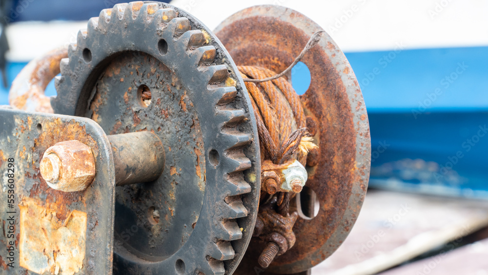Rusty chains and rope. rope winding machine. nautical instruments. Mooring boat Rusty chains and rope. rope winding machine. nautical instruments. Mooring boat