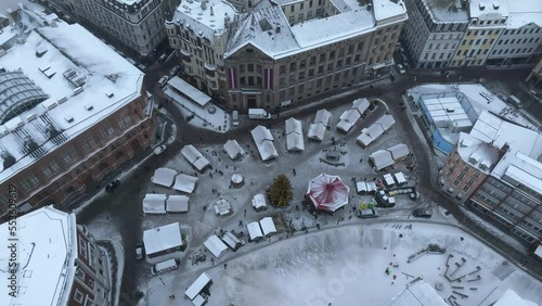 Cloudy and snowy winter over Riga city. Winter in Riga from above near Christmas market in the center of the old town.