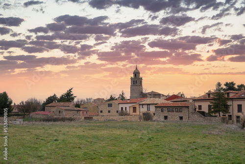 Spectacular sunset in the Medieval village of Medinaceli, photo taken outside the village. Sunset with clouds and orange sky. Date 22-6-22 photo