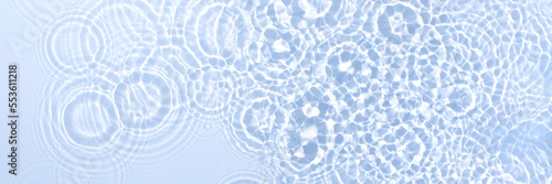 Blue water abstract banner with a clear transparent surface with droplet circles