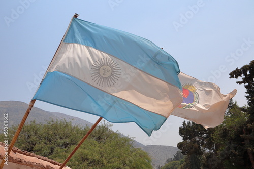 Argentina national flag with Jujuy province flag at background