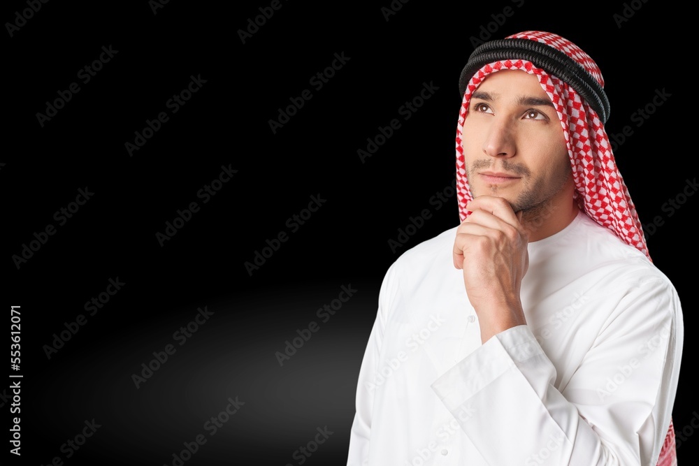 Young Arab muslim man on dark background Young Arab muslim man on dark background