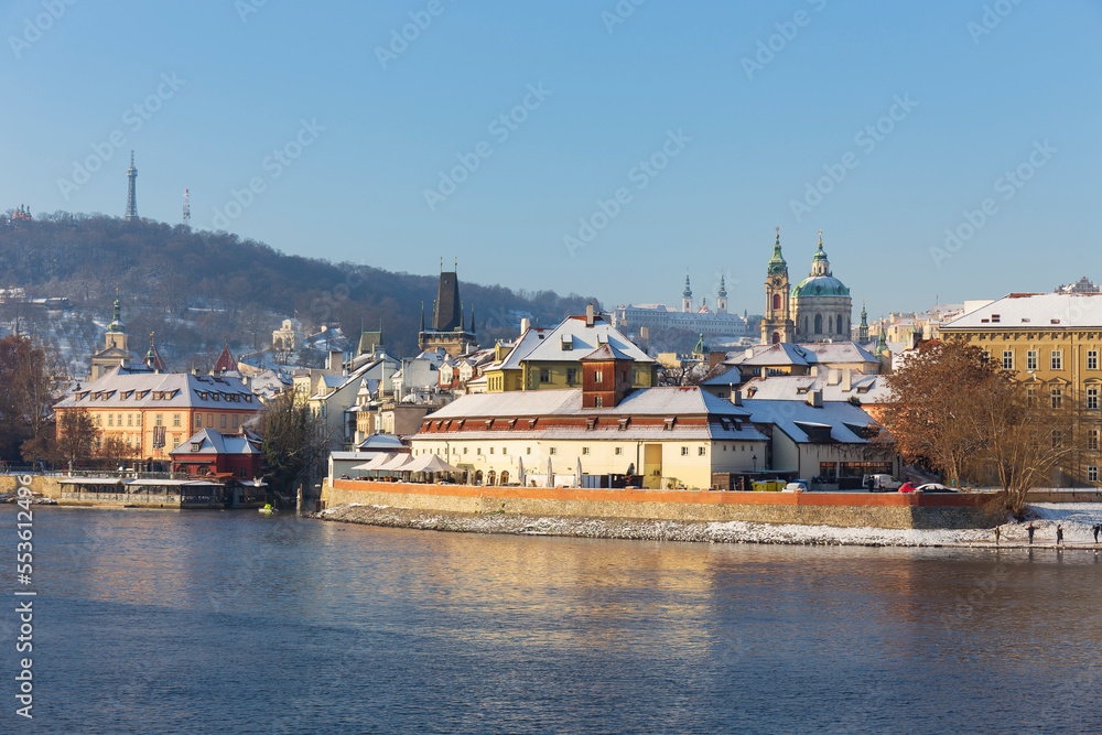 Snowy Prague Lesser Town with Prague Castle above River Vltava in the sunny Day , Czech republic Snowy Prague Lesser Town with Prague Castle above River Vltava in the sunny Day , Czech republic