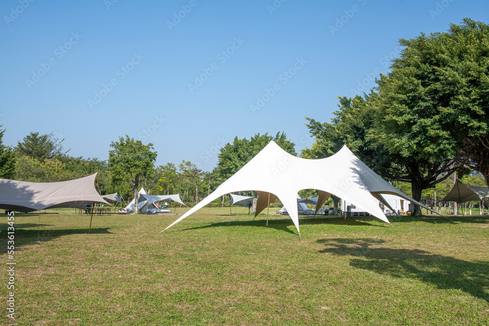 Camping tents on the park lawn Camping tents on the park lawn