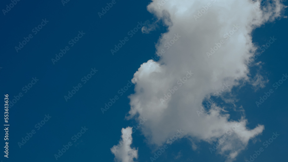 Naklejka premium A big vertical white cloud in a single cluster in a clear sky. Cloud cluster can be used for graphic works and resource