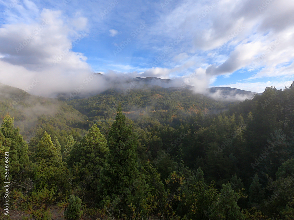 Clouds over the mountain forest on the way to Cajon del Rio Azul near the Argentine town of El Bolson