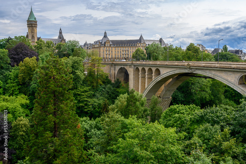 A view of the city of Luxembourg with the Adolphe Bridge. The towering building is the State Bank and Savings Fund headquarters (Spuerkeess). Luxembourg, 2021/07/04.
