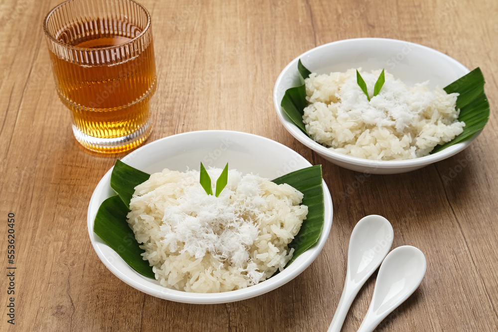 Ketan Kelapa Parut, Indonesian traditional snack, made from steamed glutinous rice and served with grated coconut
Ketan Kelapa Parut, Indonesian traditional snack, made from steamed glutinous rice and served with grated coconut