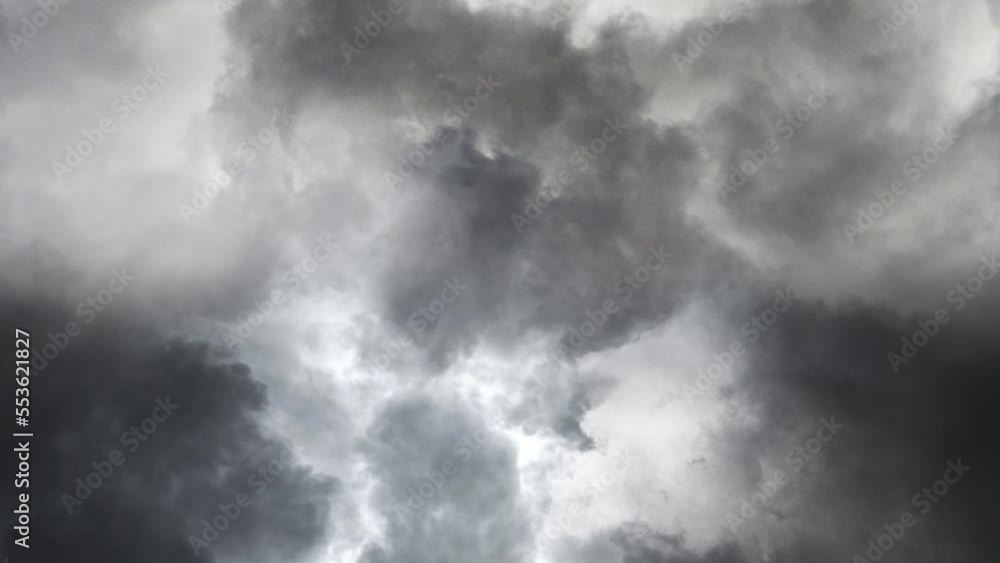 lightning strike in a thunderstorm between thick clouds lightning strike in a thunderstorm between thick clouds