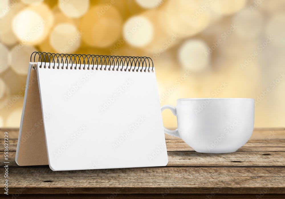 Blank desk office calendar and cup of coffee Blank desk office calendar and cup of coffee