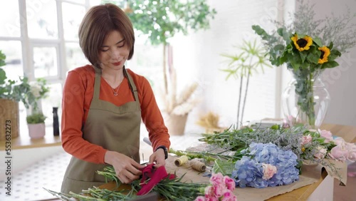 Startup successful sme small business entrepreneur owner asian woman standing table with flowers at florist shop service job. Portrait of asian girl successful owner environment friendly banner