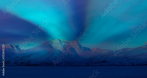 Fototapeta Naklejka Na Ścianę i Meble -  Northern lights (Aurora borealis) in the sky over Tromso, Norway - Aurora reflection on the sea on the background Norwegian fjord - Winter season.