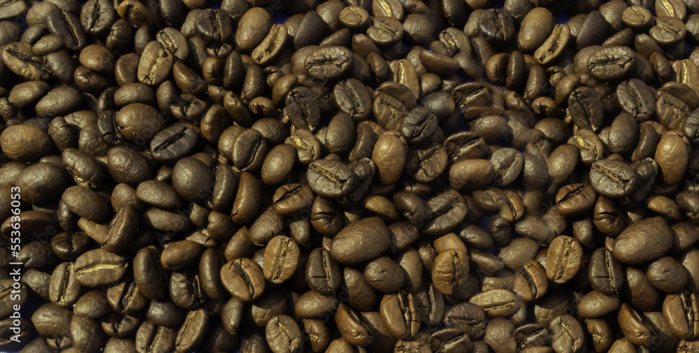 High Angle. A pile of roasted coffee beans. background pattern
