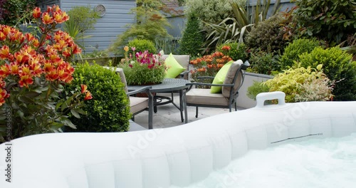 Garden inflatable hot tub, still water then air jets turned on photo