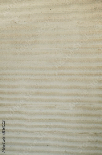 Traditional Japanese style plasterer wall background. Japanese comb striped patterned mortar cement texture.