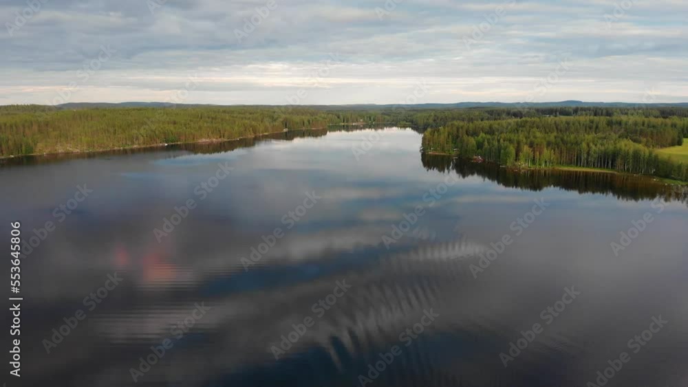 A drone shot of bay in a lake in the beautiful sunset of Finnish summer A drone shot of bay in a lake in the beautiful sunset of Finnish summer