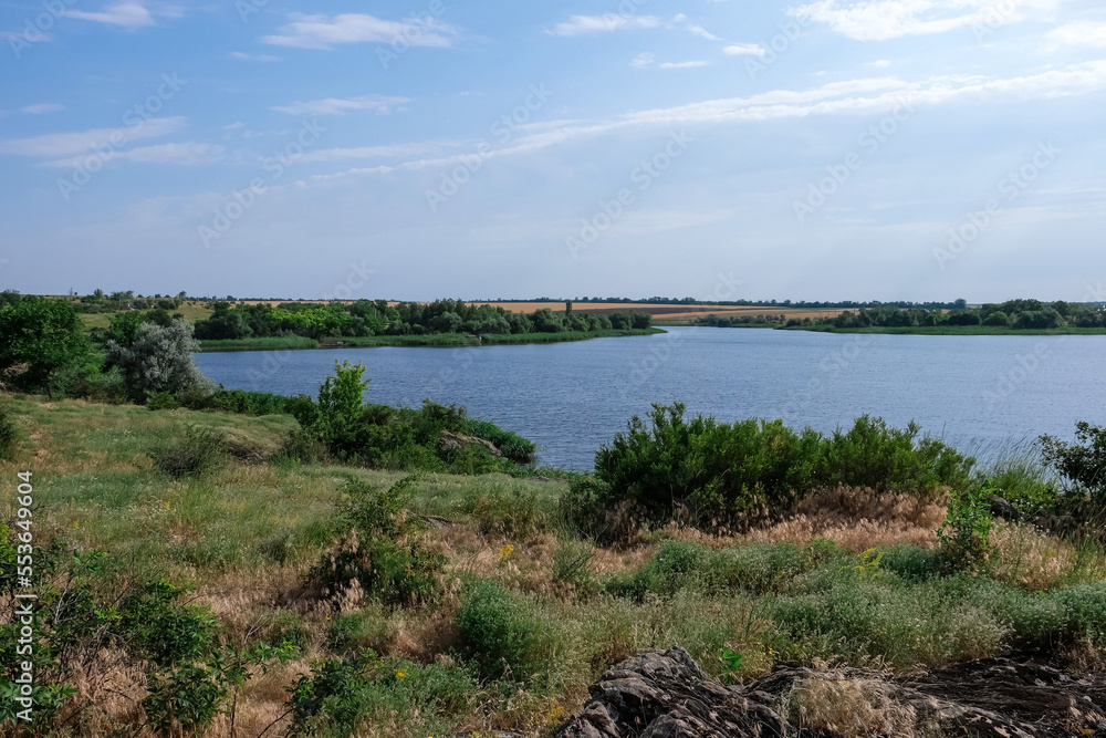 Beautiful landscape with green shore and calm river Beautiful landscape with green shore and calm river