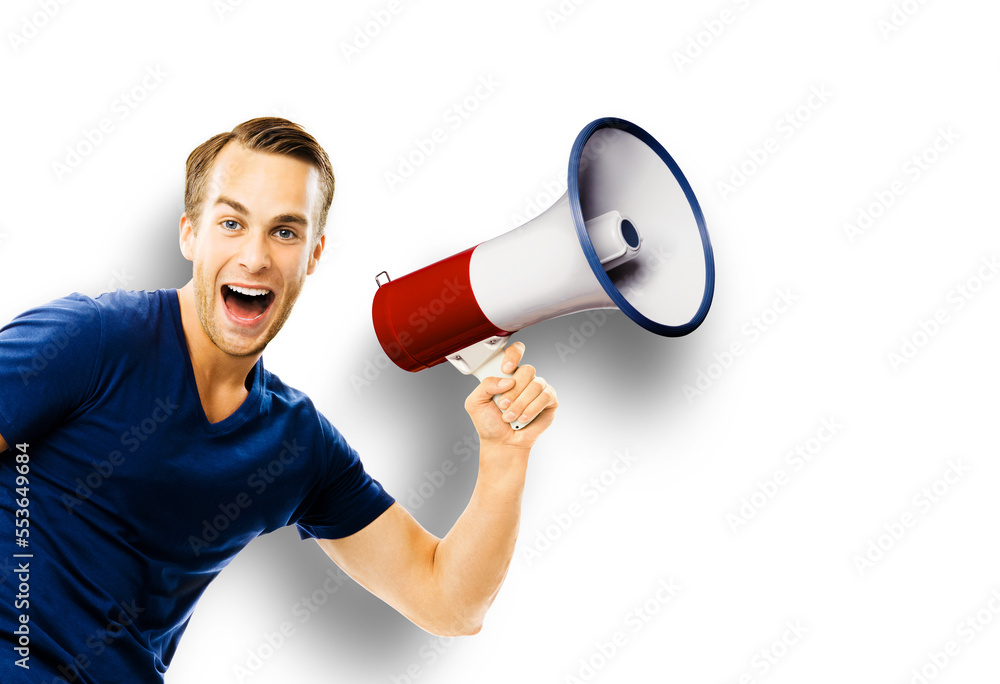 Happy excited young man with open mouth holding megaphone. Astonished guy shout saying advertising something in loudspeaker mega phone. Big sales, deals rebates discounts ad concept. White background Happy excited young man with open mouth holding megaphone. Astonished guy shout saying advertising something in loudspeaker mega phone. Big sales, deals rebates discounts ad concept. White background