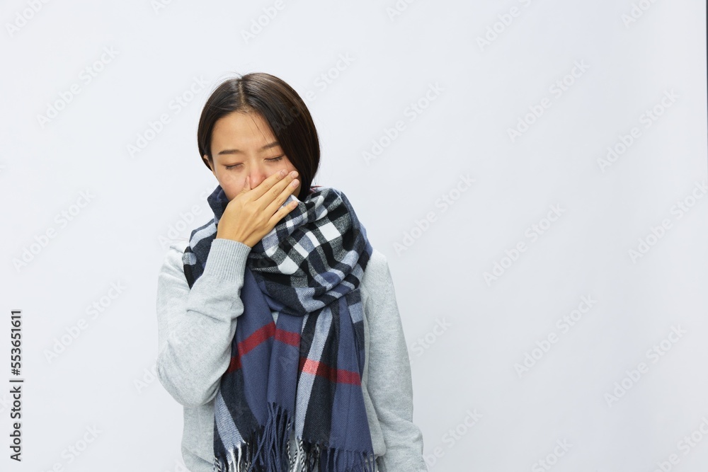 Asian woman cold flu raised hands from headache and toothache with fever sick from covid 19 virus in checkered scarf on white background, copy space Asian woman cold flu raised hands from headache and toothache with fever sick from covid 19 virus in checkered scarf on white background, copy space