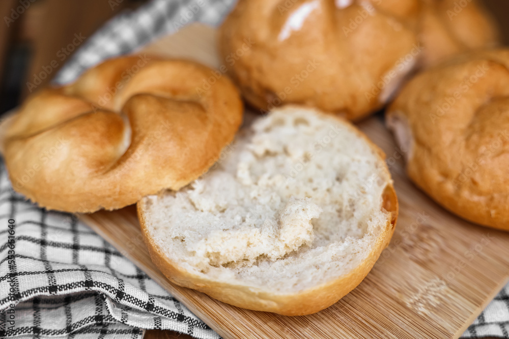 Delicious kaiser rolls on wooden board Delicious kaiser rolls on wooden board