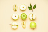Composition with cut and whole green apples on color background