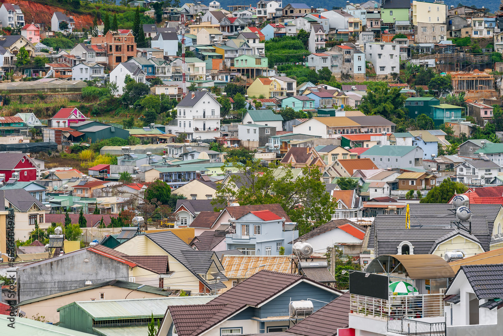 View over a city with multi coloured houses and shops at Dalat in Vietnam