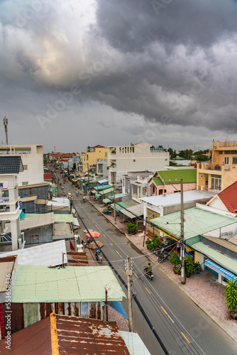 Elevated view of a streetscape with dark clouds building overhead at Chau Doc in Vietnam