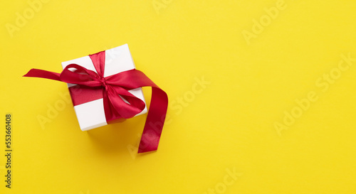 Gift box on yellow background