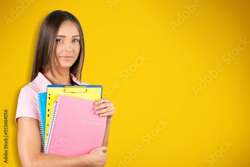 Young smart student with books, university concept