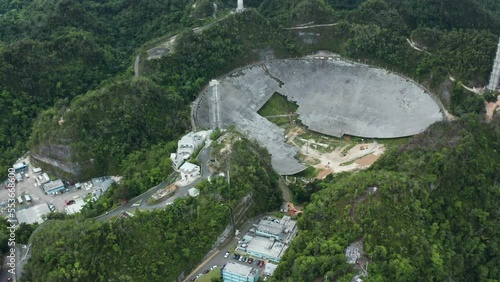 Dolly out shows ongoing deconstruction of parabolic antenna dish at Arecibo Observatory, Puerto Rico photo