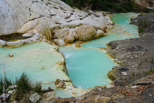 Hot springs at Bagni San Filippo  with calcium carbonate deposits surrounding the thermal water