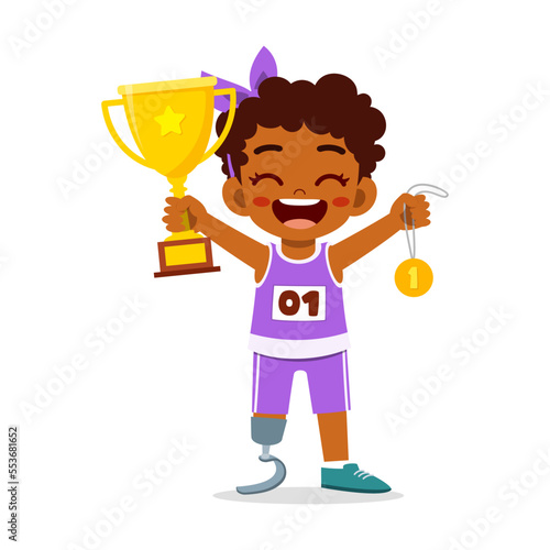 little kid with prosthetic holding medal and trophy