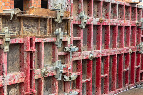 Reinforced concrete foundation of a modern monolithic residential building. Prepared formwork with reinforcing mesh for pouring concrete. Monolithic construction technologies.