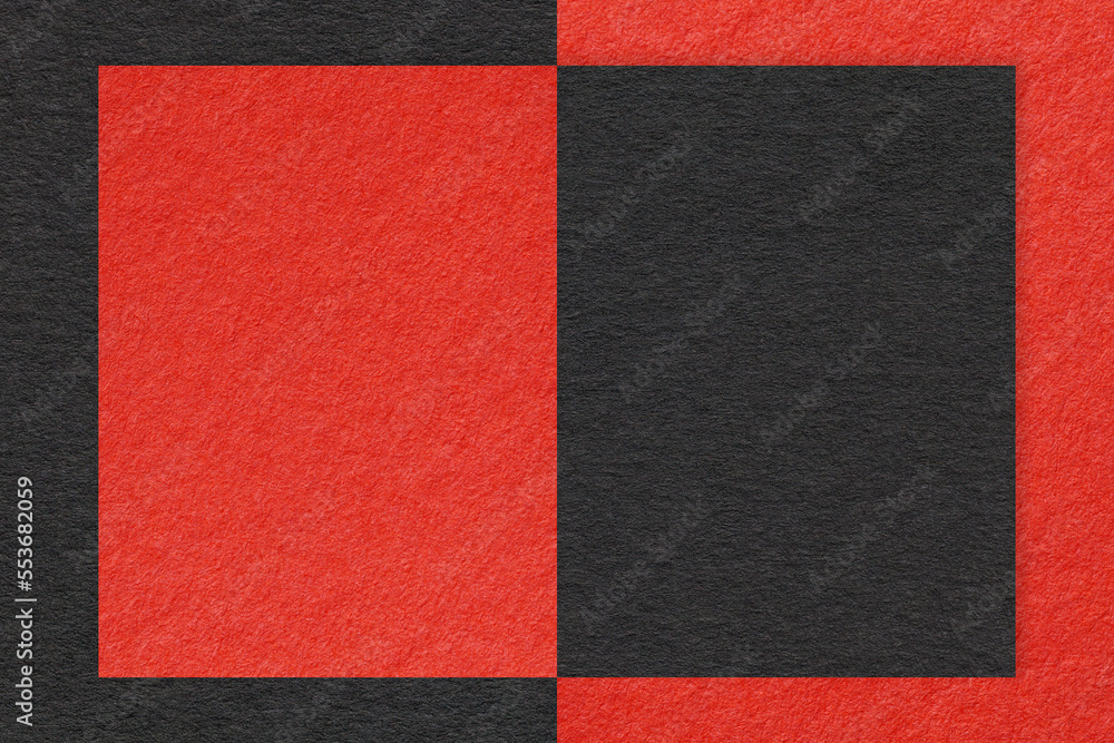 Fototapeta premium Texture of red and black paper background with geometric shape and pattern, macro. Structure of craft cardboard