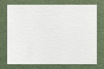 Texture of craft white color paper background with green border, macro. Structure of vintage olive cardboard