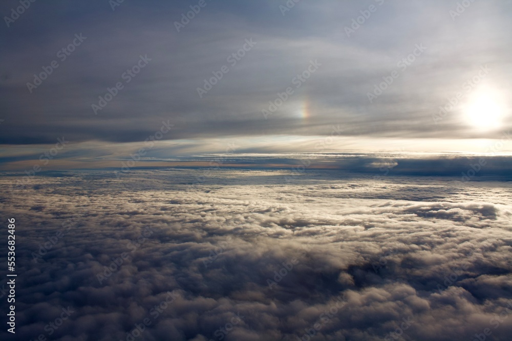 clouds seen from above with sunlight form the sun off frame