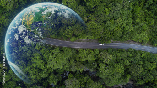 Electric car and EV electrical energy for environment, EV car on forest road with earth planet going through forest, Ecosystem ecology healthy environment, Electric car with nature, Save earth energy.