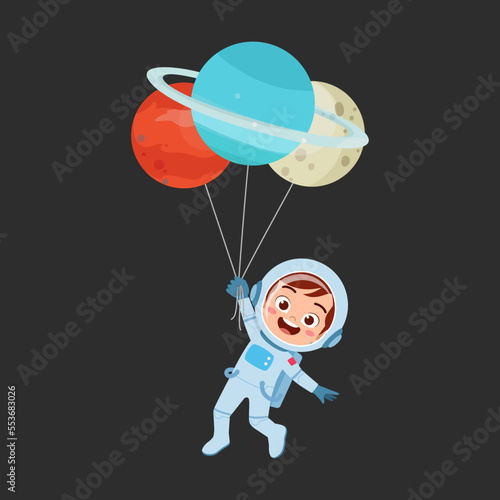 little kid wearing astronaut costume and holding balloon