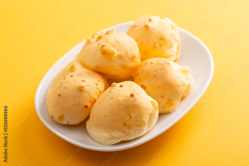 Brazilian snack pao de queijo cheese bread on white dish Brazilian snack pao de queijo cheese bread on white dish