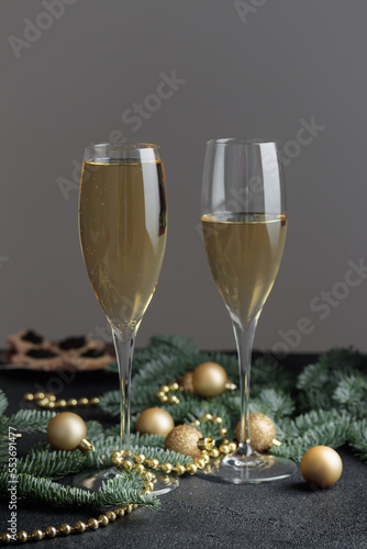 New year's eve, glass of champagne on black table, Cristmas decoration background
