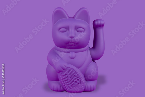 Purple lucky cat manekin neko on purple background