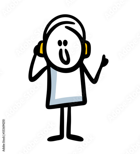 Funny teenager with headphones listening to an online audiobook lesson and enjoying music.