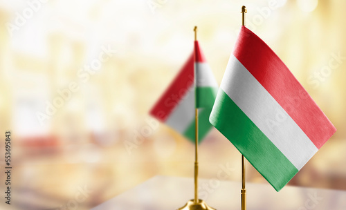Valokuva Small flags of the Hungary on an abstract blurry background