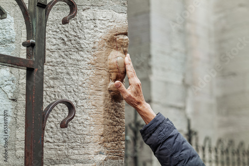 Dijon,France-October 2022: Magic Owl carved in relief on north wall of Eglise Notre-Dame de Dijon
