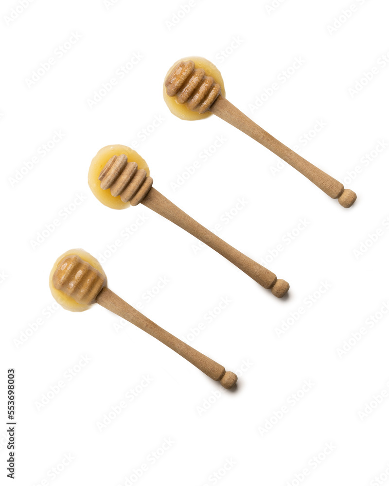 Honey with honey dipper isolated on white background. Top view. Honey with honey dipper isolated on white background. Top view.