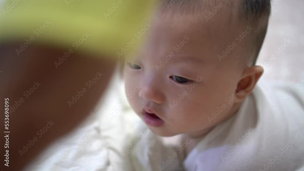 Little baby curious with the hand puppet doll. Little baby curious with the hand puppet doll.